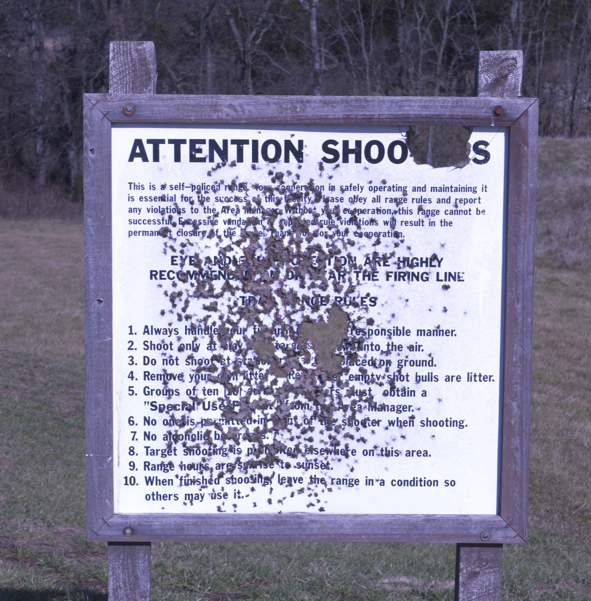 bulleted shooting range sign
