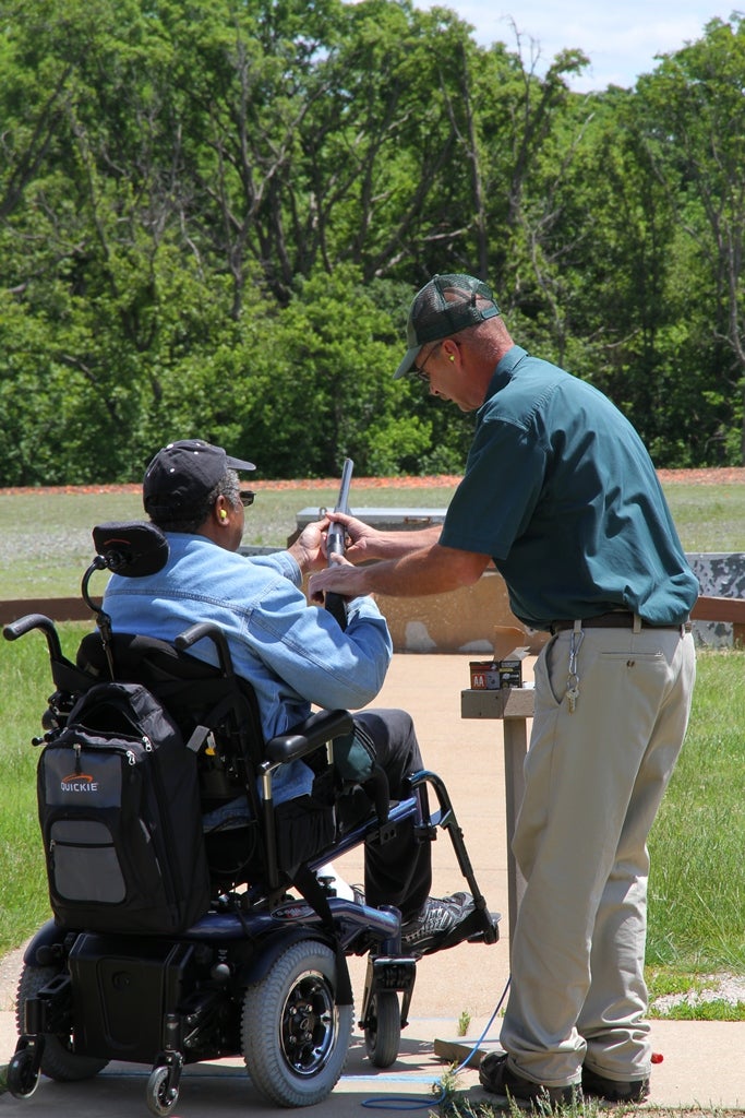 MDC staff helps injured veteran LaRoy Smith shoot trap