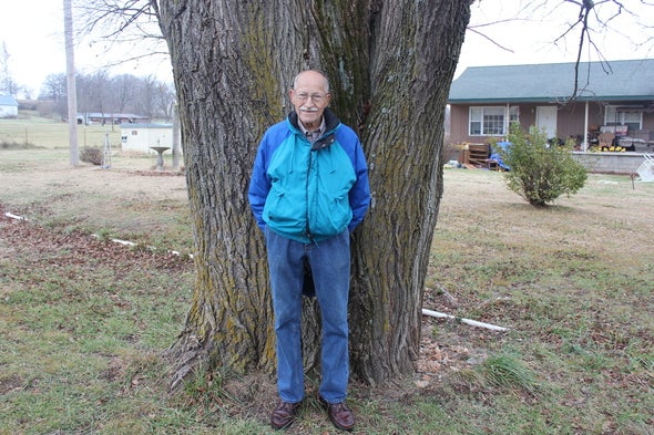 Dean Ogden in front of State Champion Slippery Elm