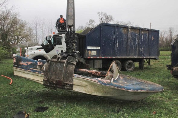 Fiberglass boat was among some of the trash volunteers picked up over the weekend.
