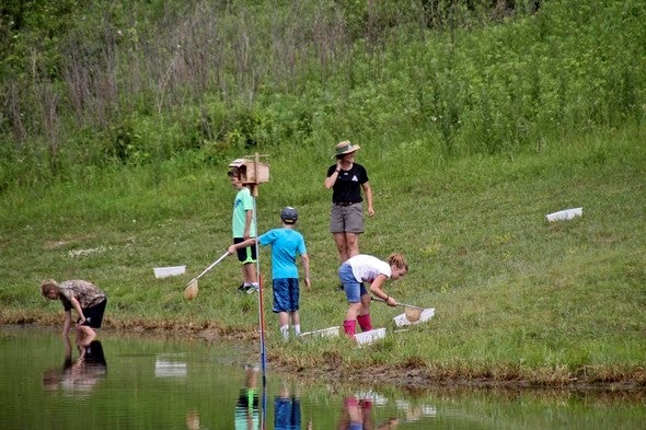 Youngsters explore aquatic life at Burr Oak Woods pond