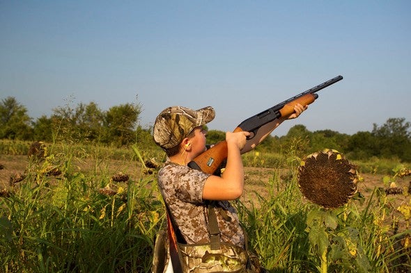 Kid hunting doves.