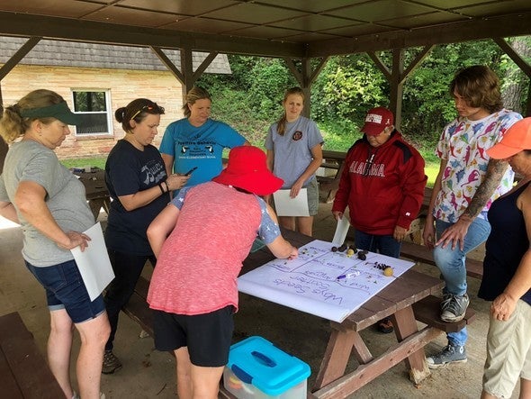 Teacher learning about nature and ways to teach it in the classroom.