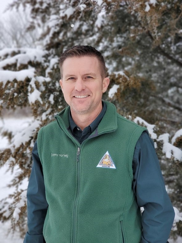 Danny Hartwig poses for a picture in the snow.