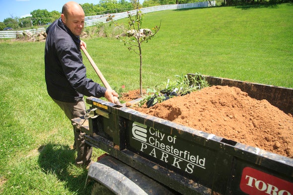 Person shoveling soil at Eberwein Park