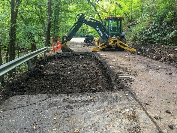 MDC crew working fix Rockwoods Reservation sinkhole.