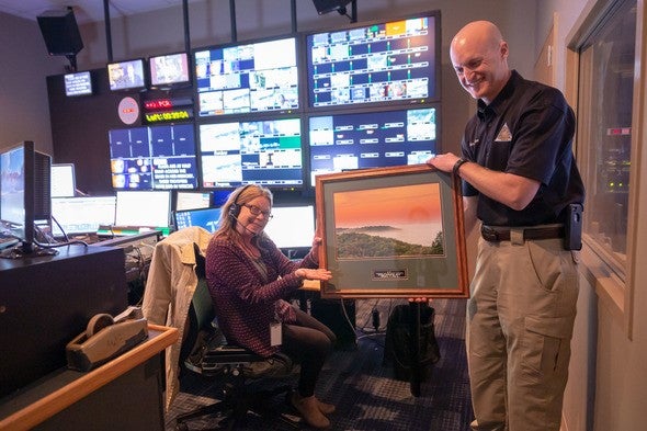 MDC Outreach and Education Chief Shawn Gruber (right) presents Fox 2/KPLR-11 Midday News Producer Peggy Dierssen with the 2018 MDC Statewide Outreach and Education External Partnership Award. 