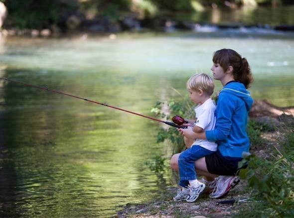 Mother and child fishing.