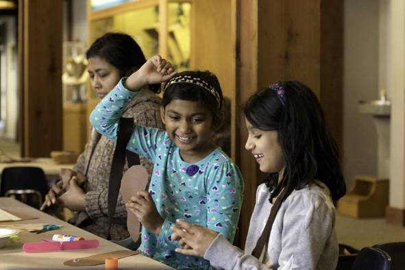 Little girls making crafts.