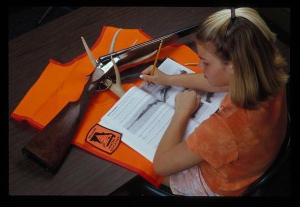 Little girl taking the Hunter Education Skills Course.