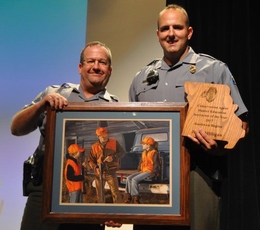Jarad Milligan getting hunter Ed award