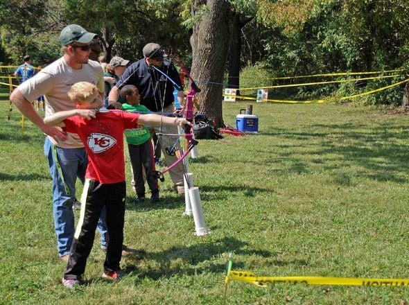 Kids shooting bows.