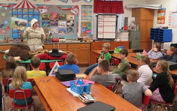 Teachers teaching students about the outdoors and Lewis and Clark.