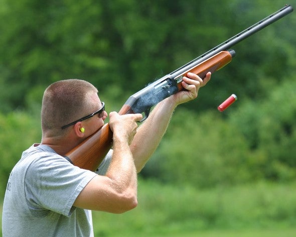 Man Shooting Shotgun
