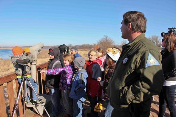 Eagle Days visitors looking through spotting scopes in hope to find eagles.