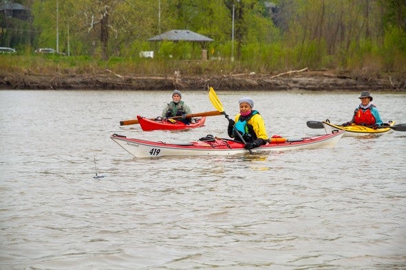 Three kayakers