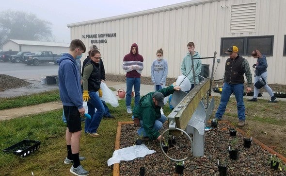 Trenton High School students plant wildflowers for pollinators