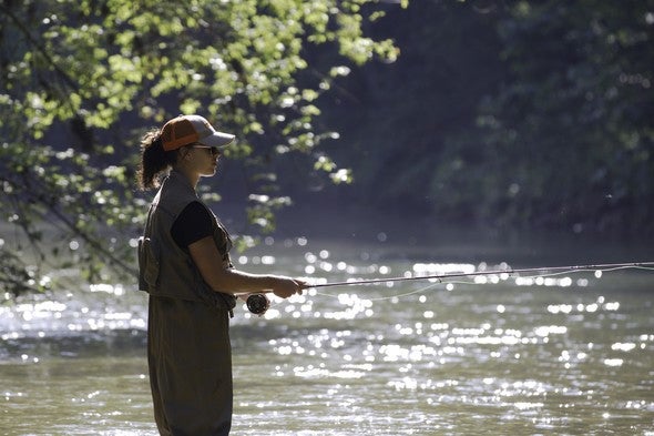 A woman trout fishing at Maramec Spring Park