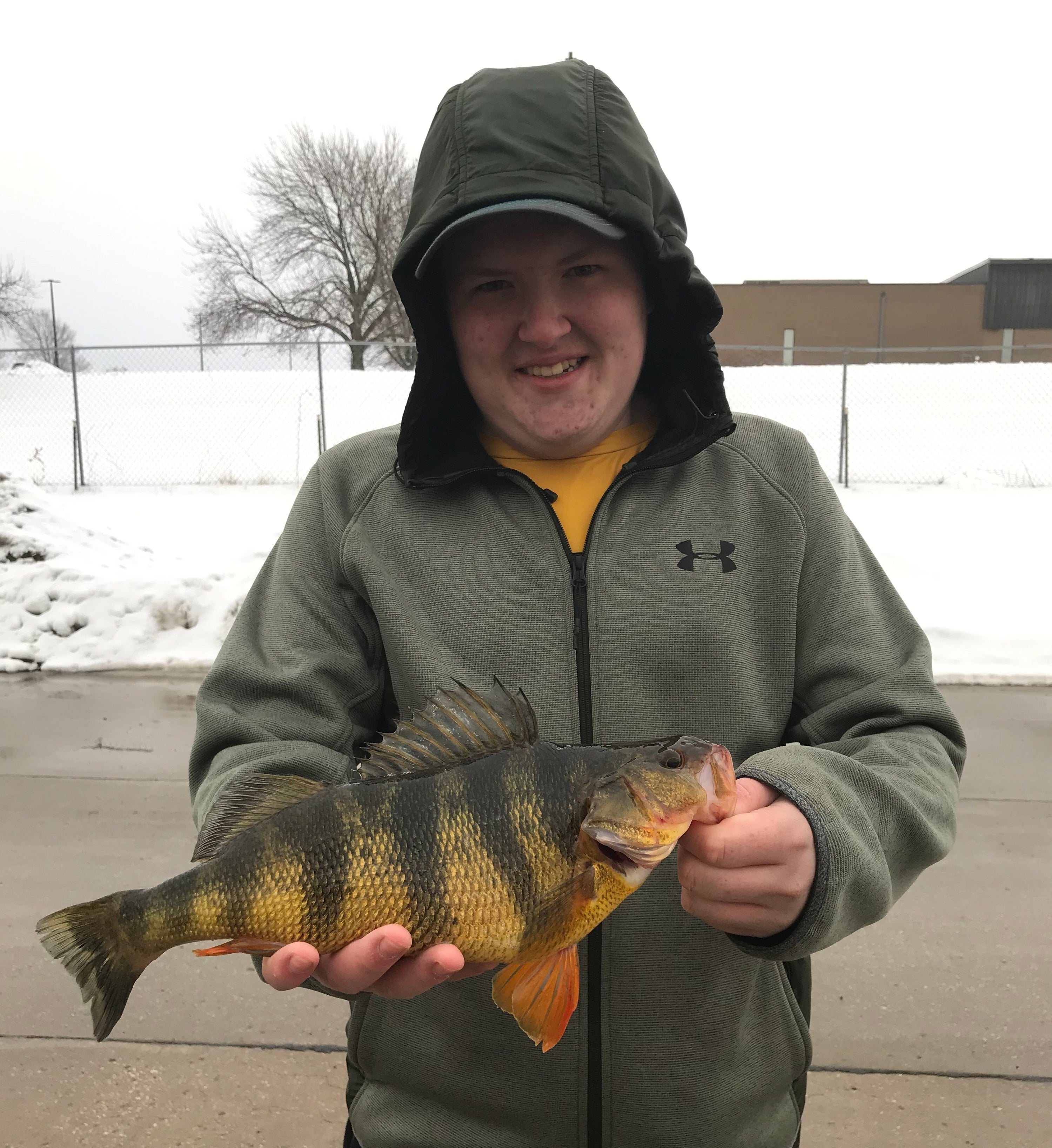 Tyler Halley shows off his state-record yellow perch.