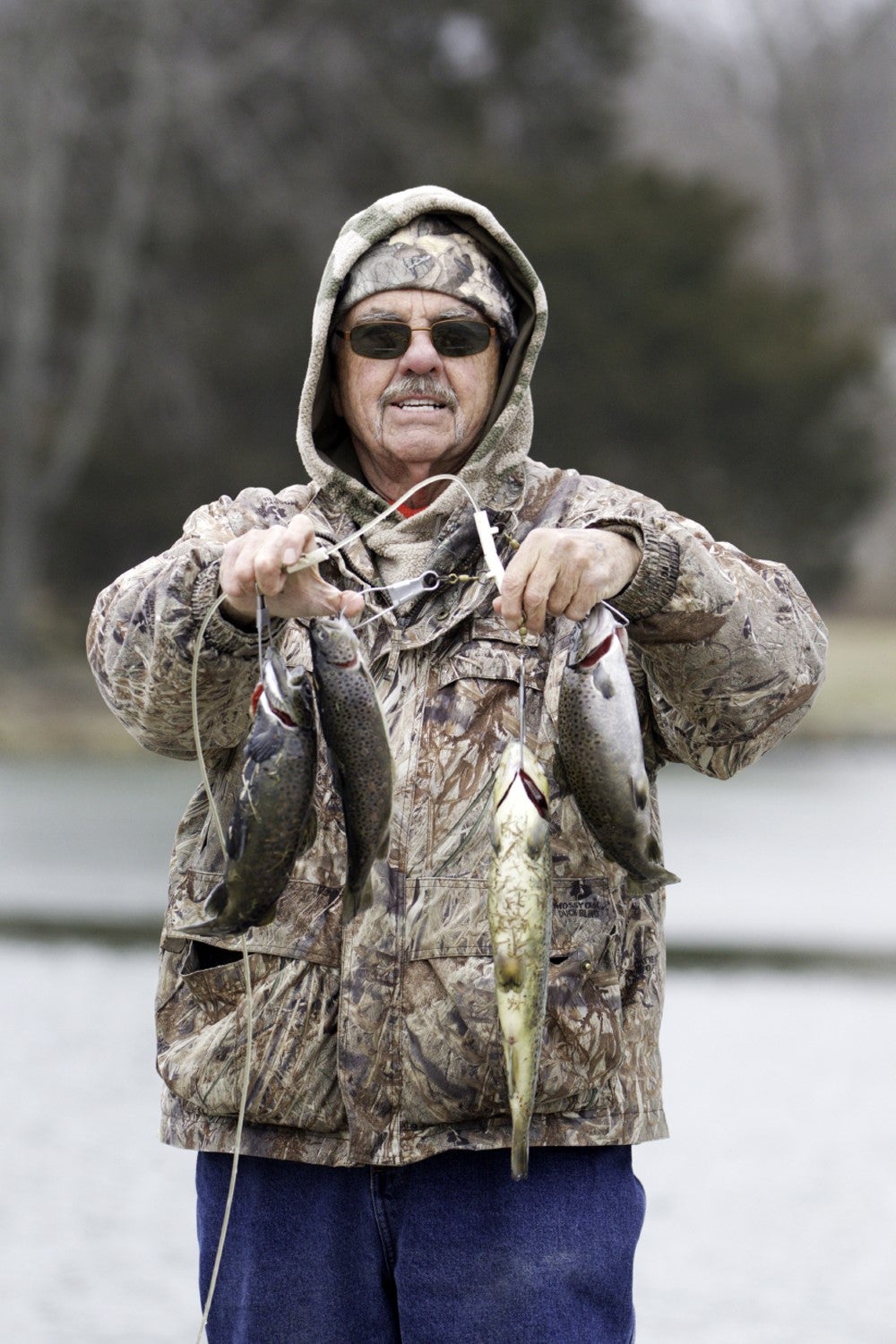 A trout angler shows off his catch