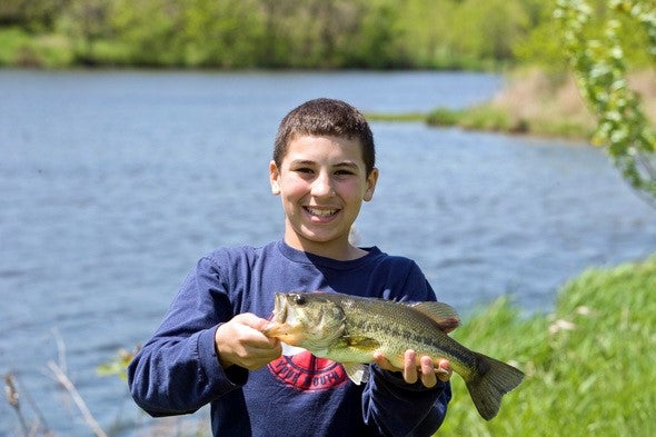 boy holding bass