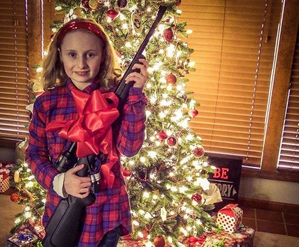 girl with firearm for the holidays