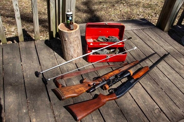 firearms with cleaning supplies