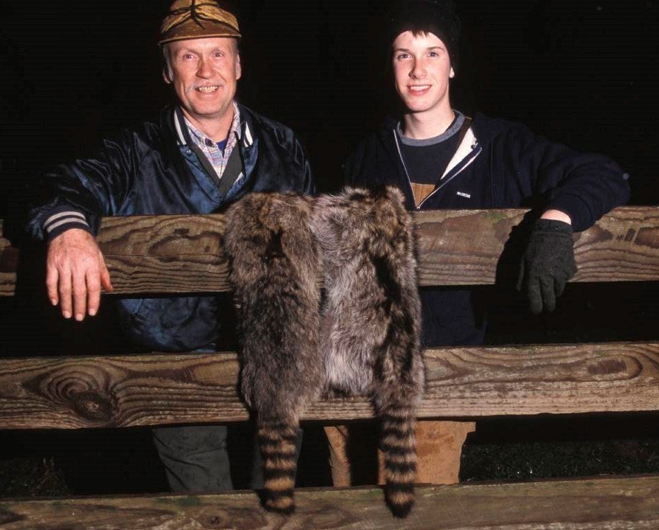 Men with raccoon pelt