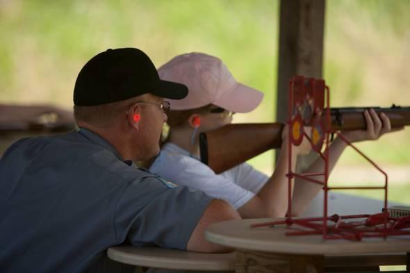 Instructor showing person how to shoot at Dalton Shooting Range 