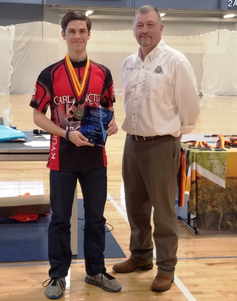 Sam Sisk with MDC's Eric Edwards receiving the his awards.
