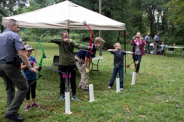 participants try archery