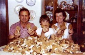 A family at a table after hunting mushrooms