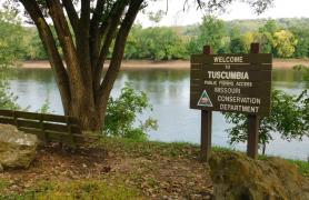 Tuscumbia Access CA, showing sign, park bench, tree, and Osage River