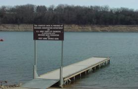 Courtesy dock stretching out over portion of Bull Shoals Lake.