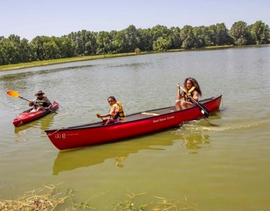  Teens canoeing and person kayaking