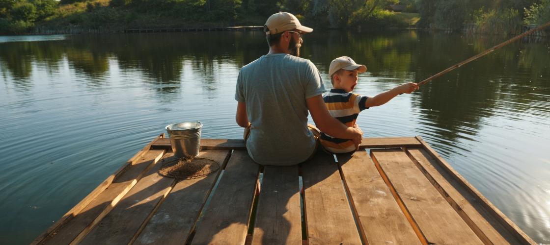 Dad and son on fishing dock