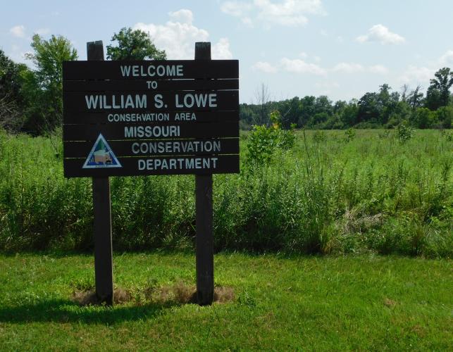 William S. Lowe Conservation Area, Audrain County, area sign with grassland beyond