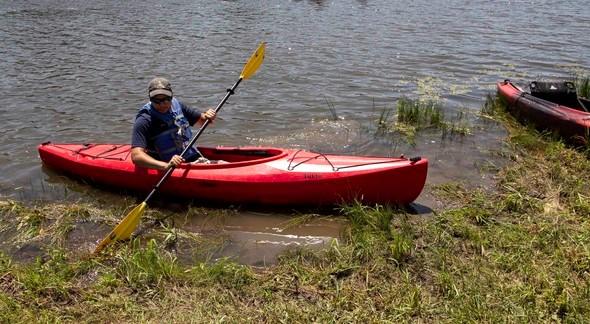 MDC staff member on a kayak