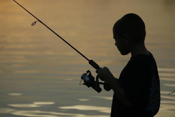 Boy fishing silhouette
