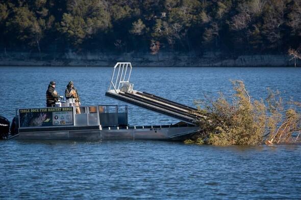 MDC staff dump trees in lake for fish habitat