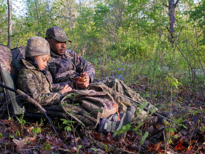 Father and daughter turkey hunting