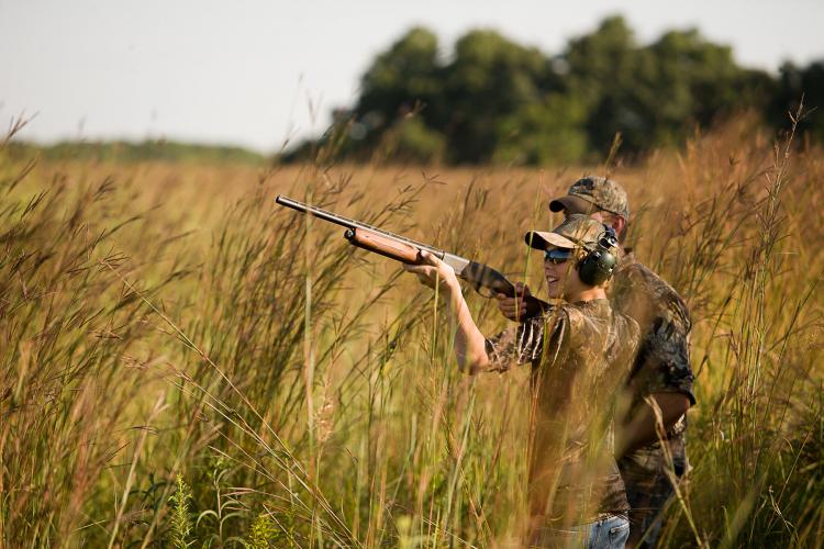Young boy dove hunting with over-ear protection
