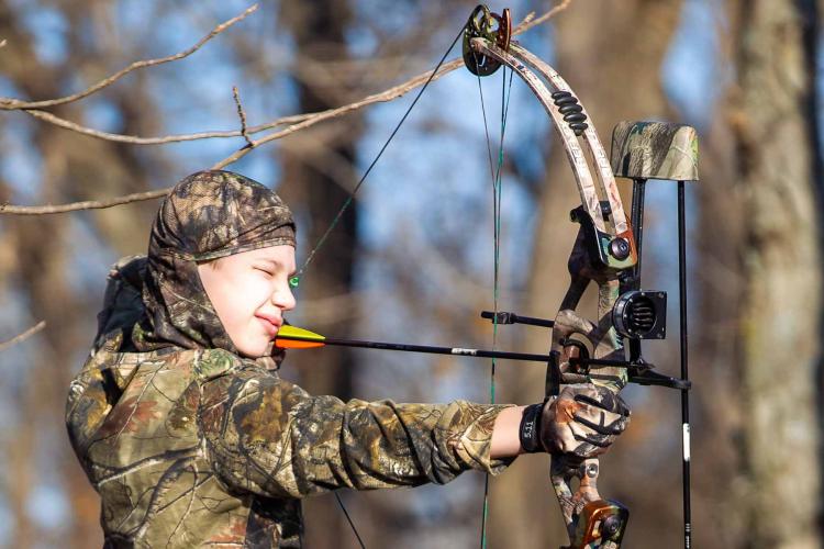Young bow hunter takes aim