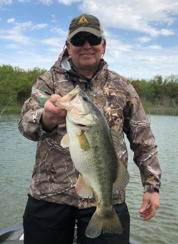 Commissioner Harrison holding a bass