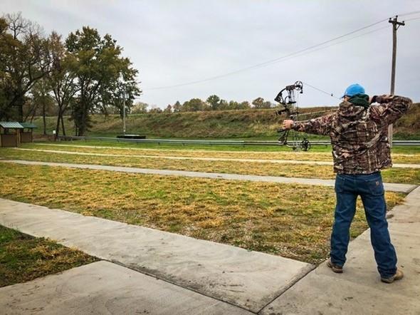 Someone shooting a bow.