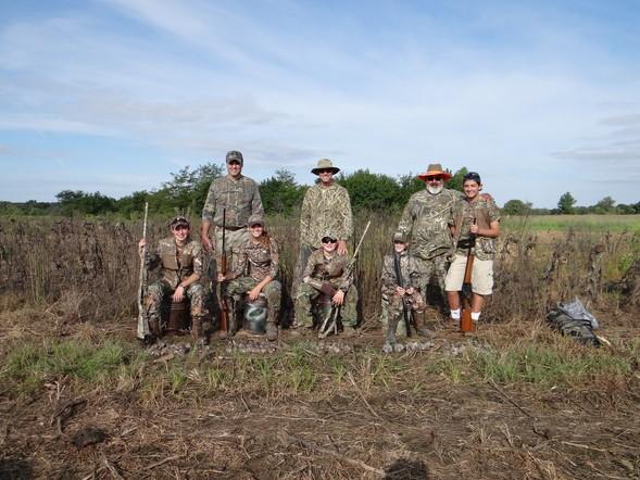 posed group of dove hunters standing in field