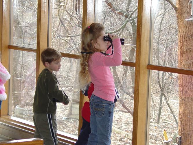 Kids looking through binoculars at Powder Valley