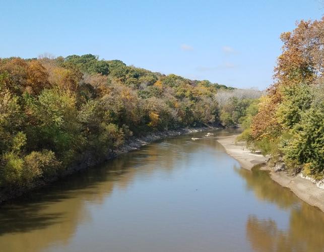 View of Upper Grand River showing autumn trees along both banks.