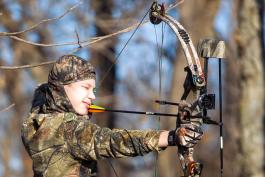 Young bow hunter takes aim