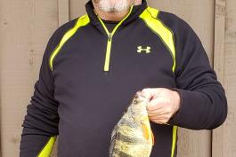 Brian Holiday holds his state-record yellow perch.